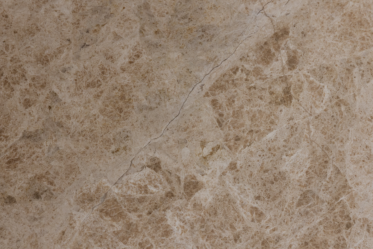 Close-up of a beige stone surface with natural patterns